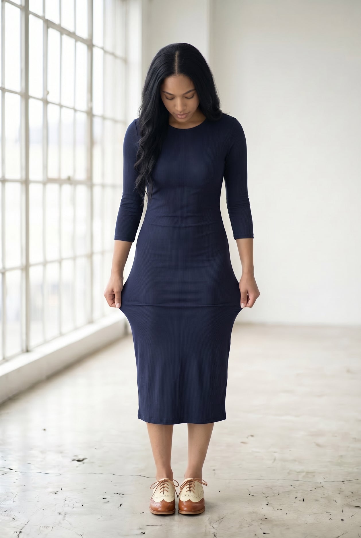 Model wearing Nuggles® Ribbed Midi Layering Dress in Navy