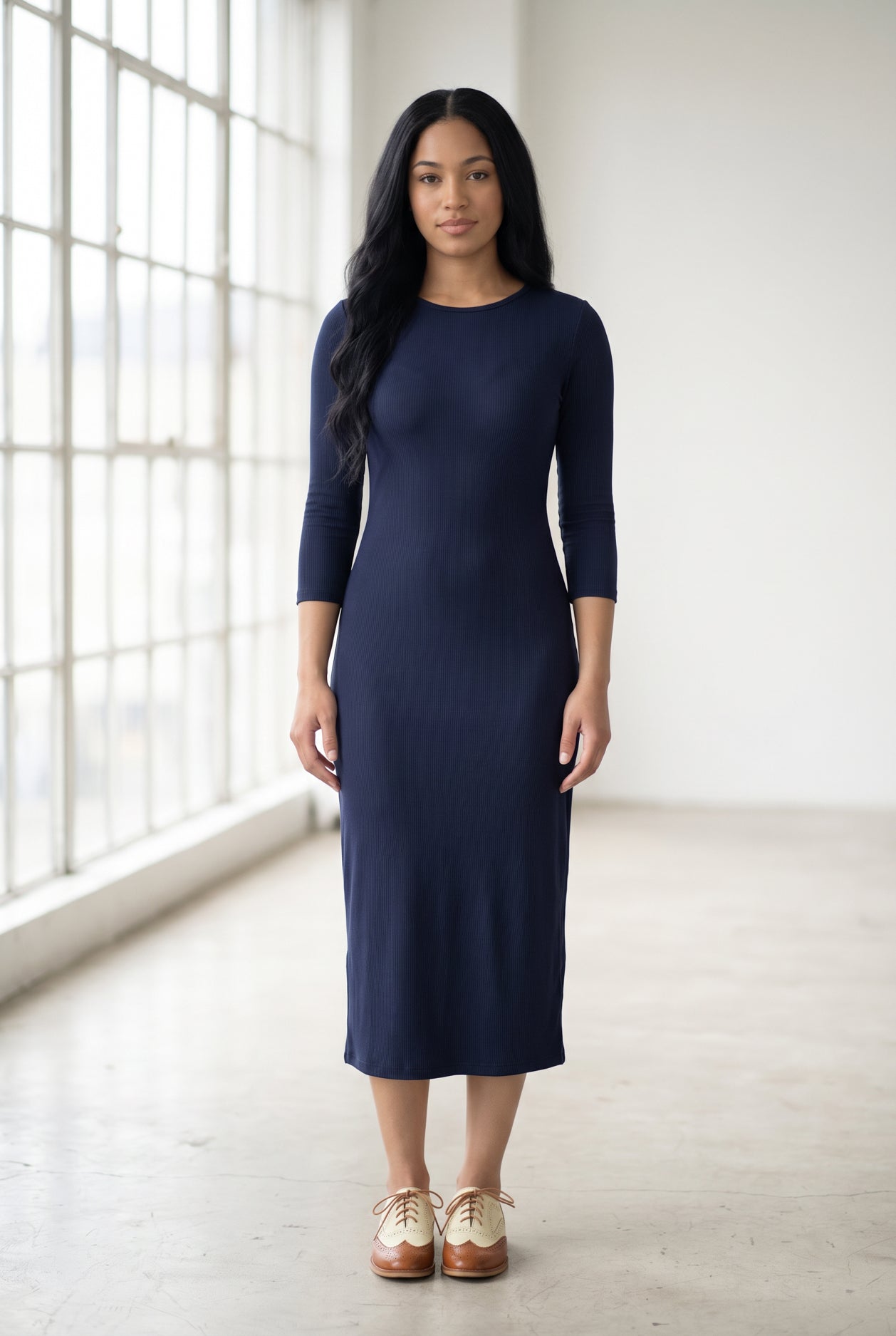 Model wearing Nuggles® Ribbed Midi Layering Dress in Navy