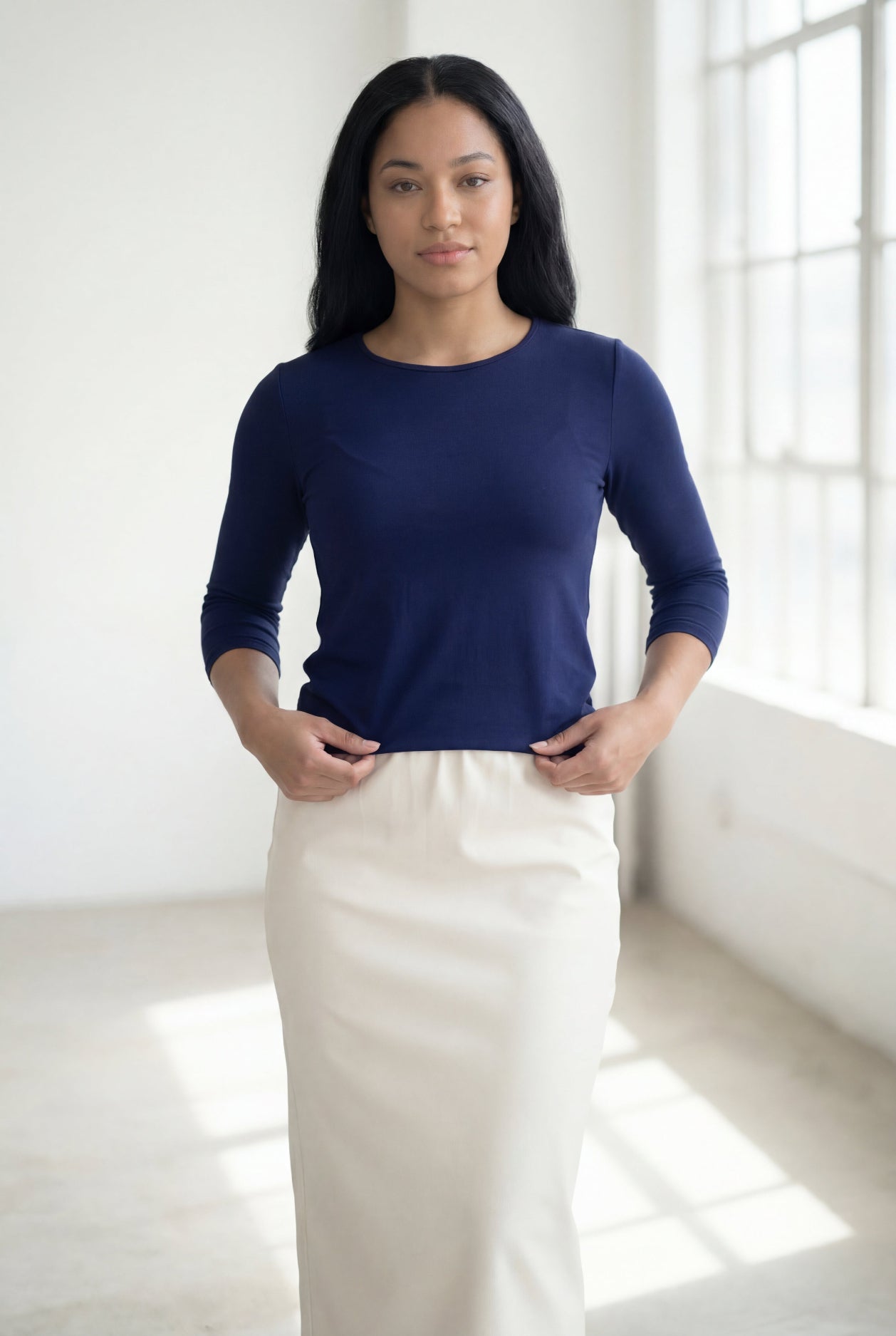 Model wearing Nuggles® 3/4 Essential Tee in Navy