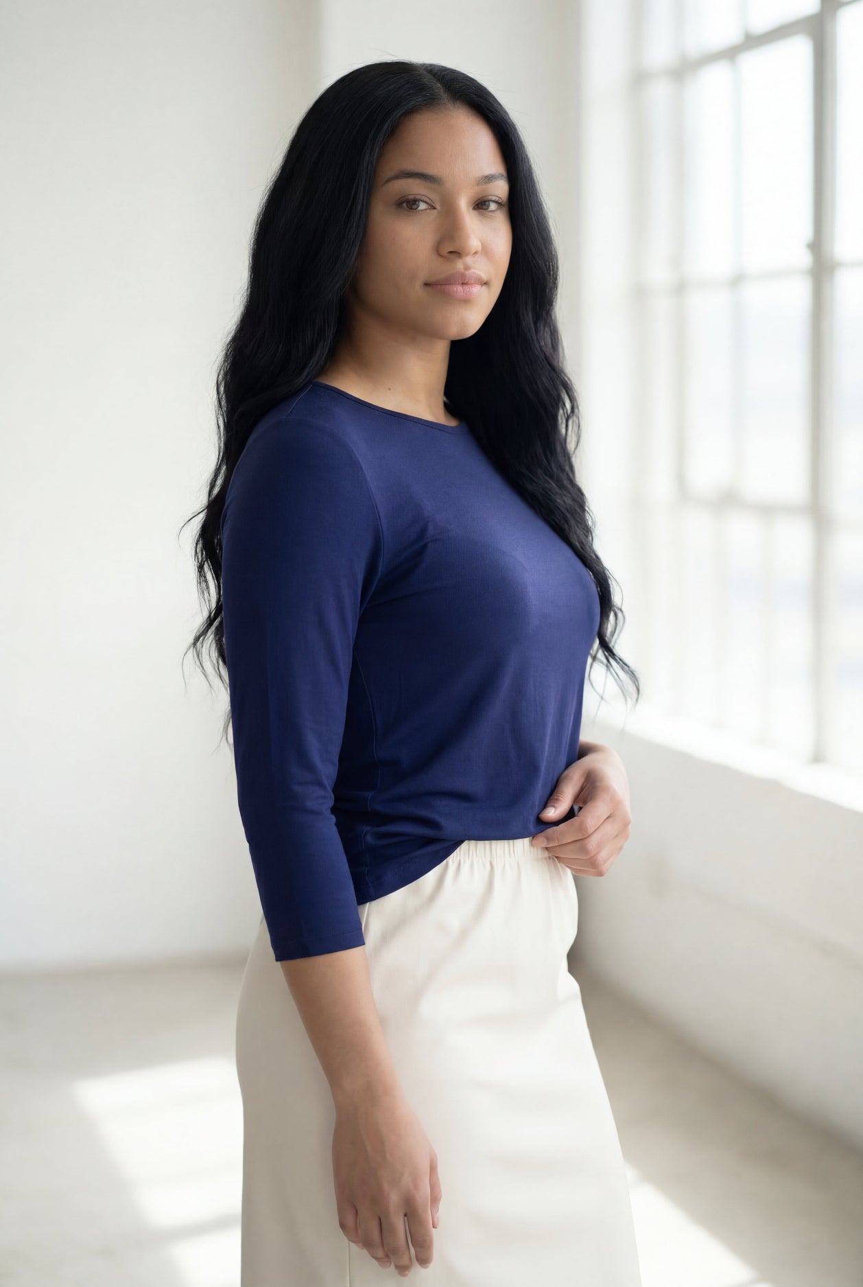 Model wearing Nuggles® 3/4 Essential Tee in Navy