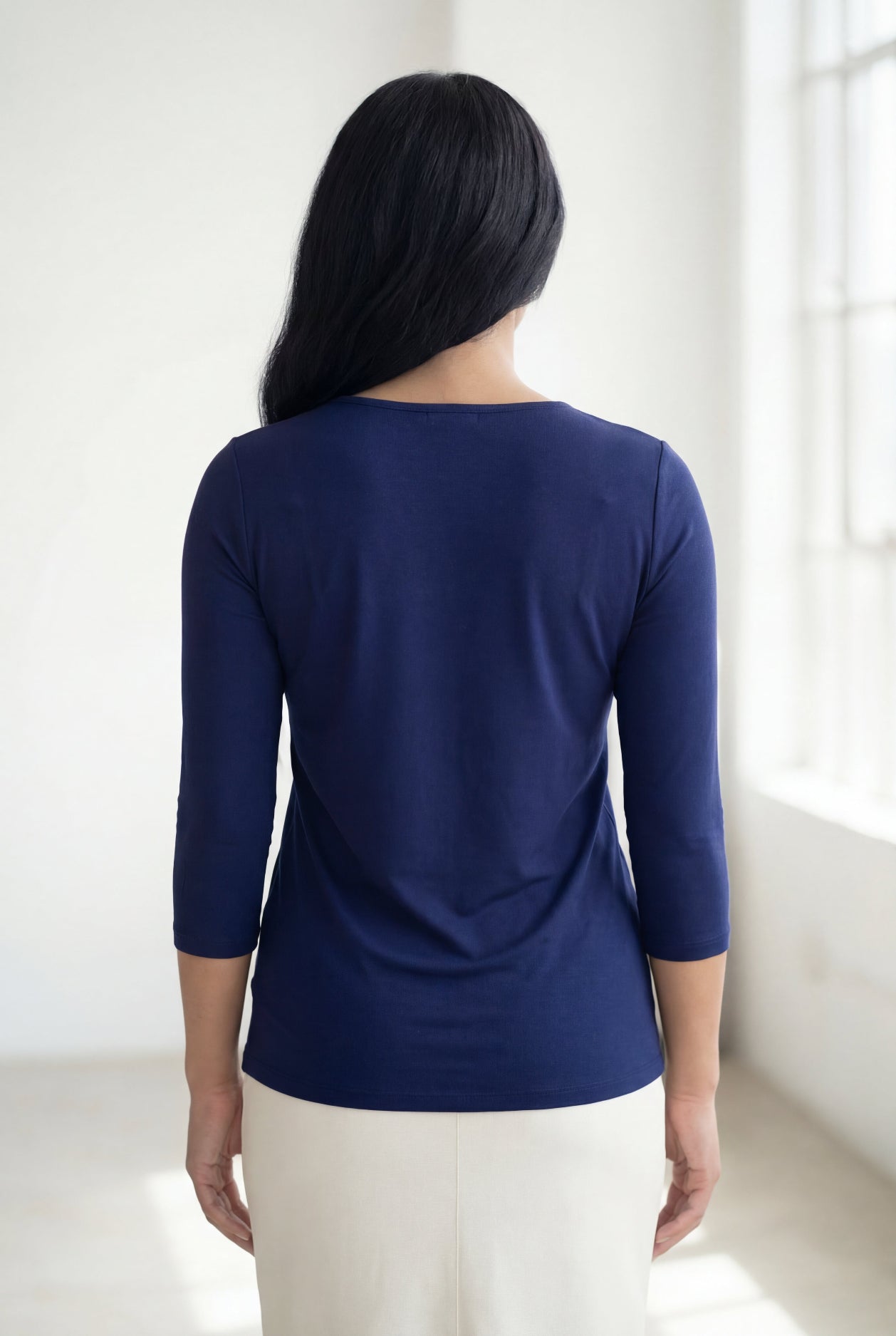 Model wearing Nuggles® 3/4 Essential Tee in Navy