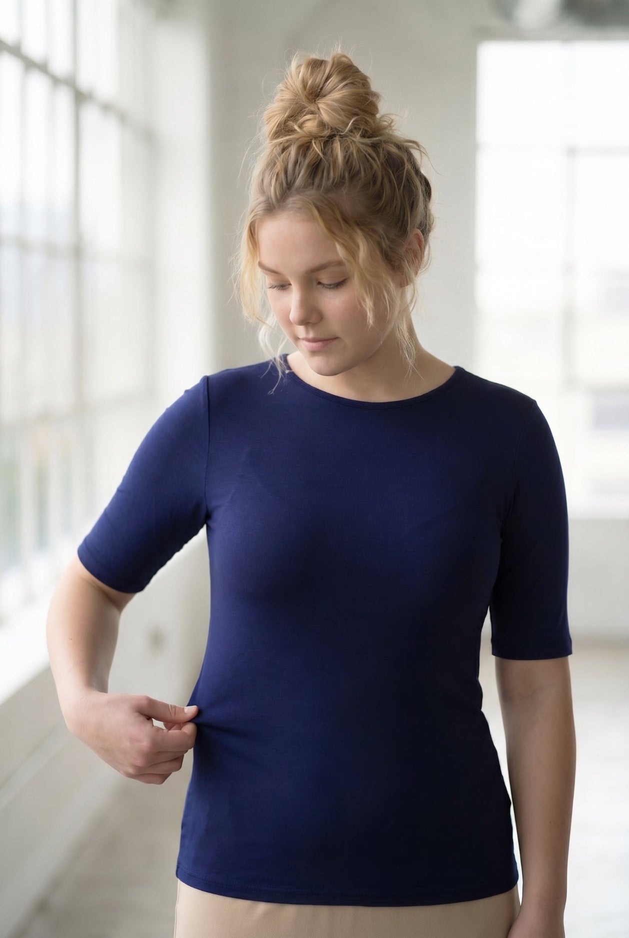 Model wearing the Nuggles® Essential Half Sleeve Tee in Navy