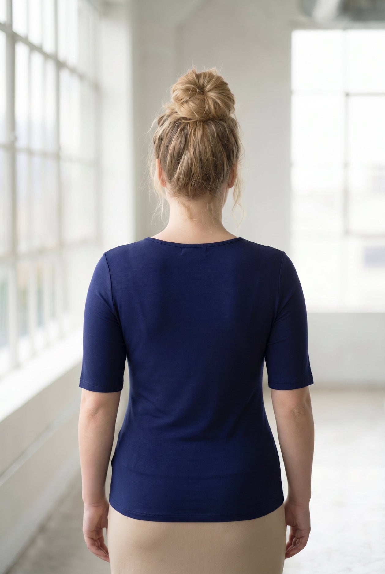 Model wearing the Nuggles® Essential Half Sleeve Tee in Navy