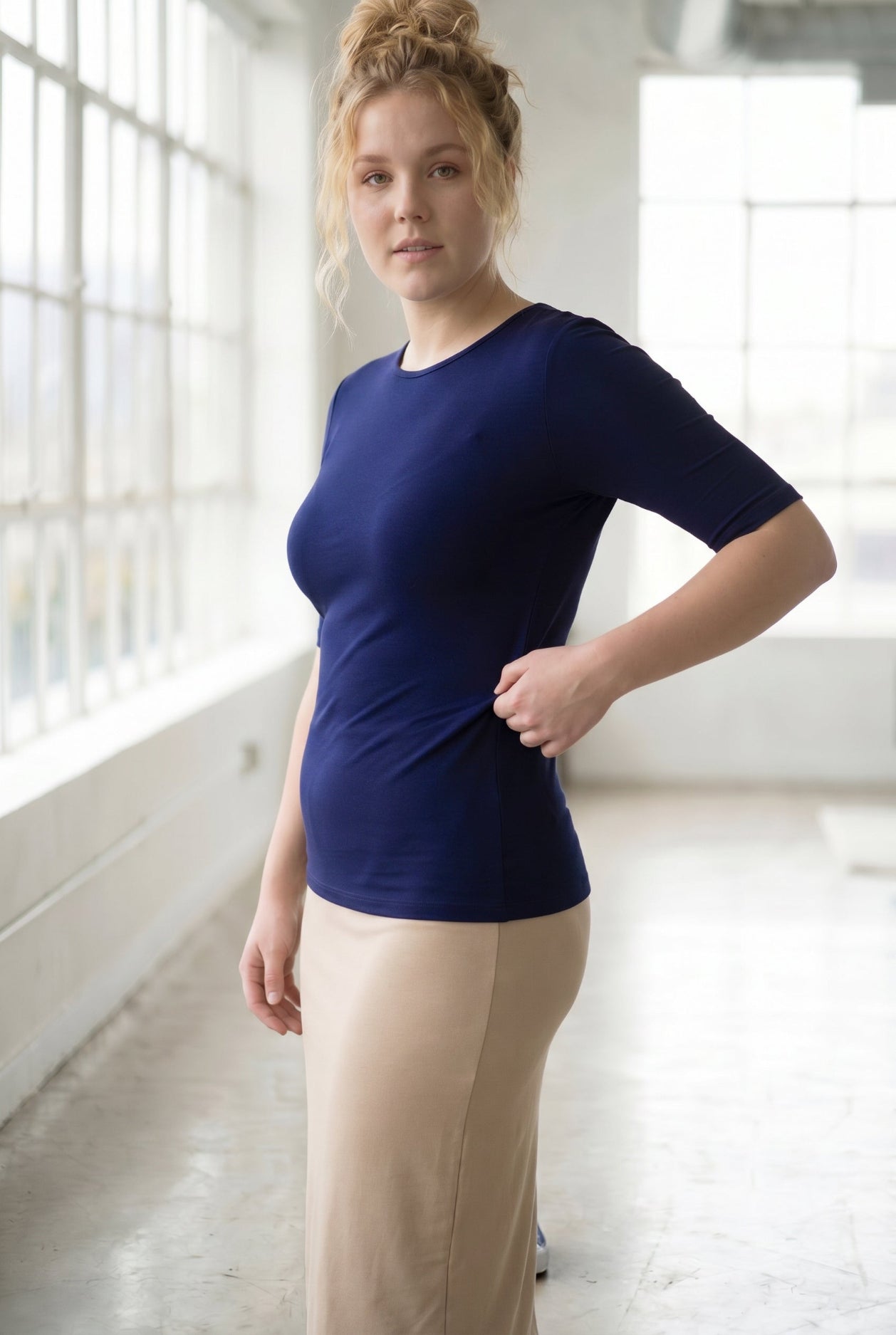 Model wearing the Nuggles® Essential Half Sleeve Tee in Navy
