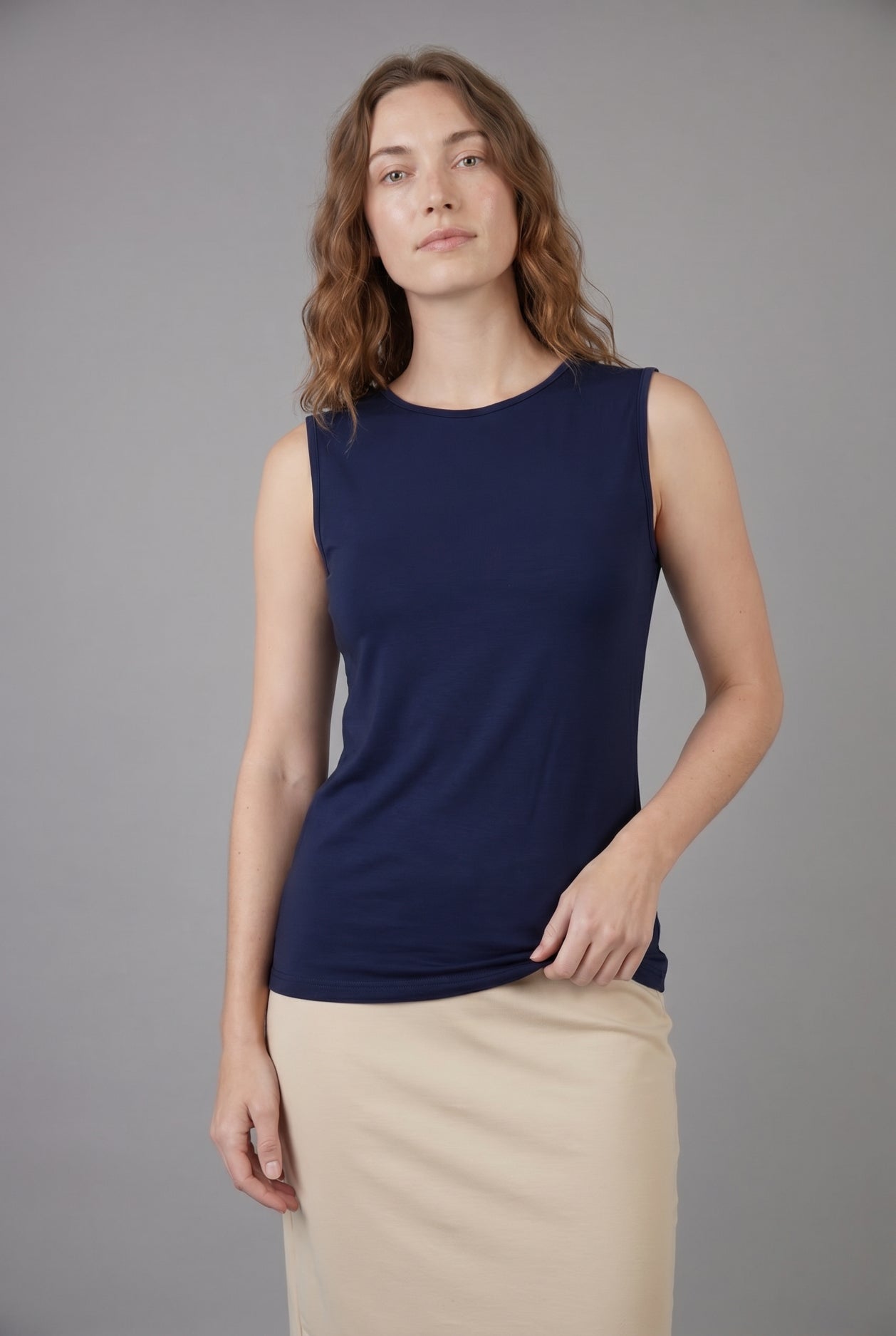 Model wearing Nuggles® Essential Tank in Navy