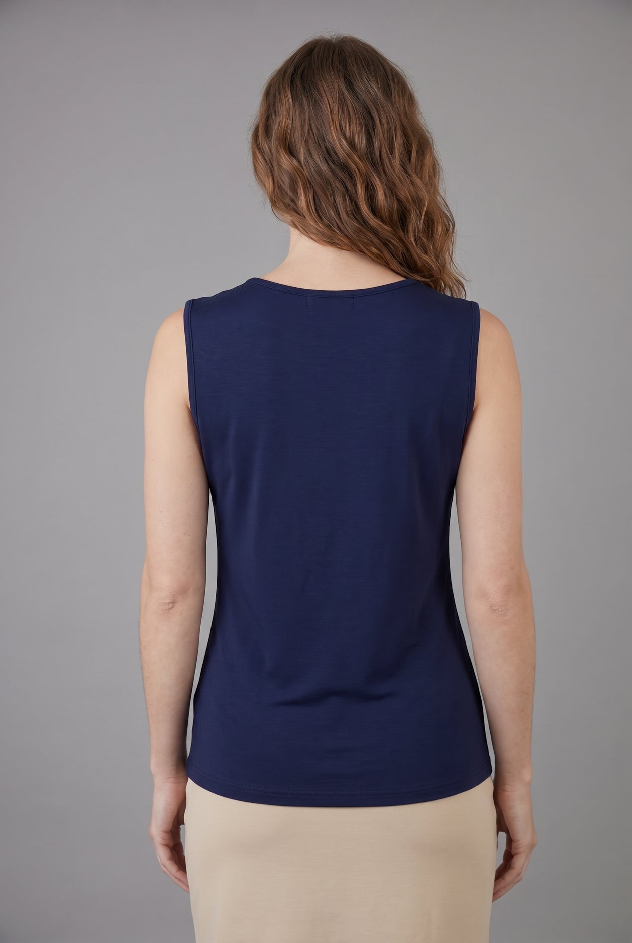 Model wearing Nuggles® Essential Tank in Navy