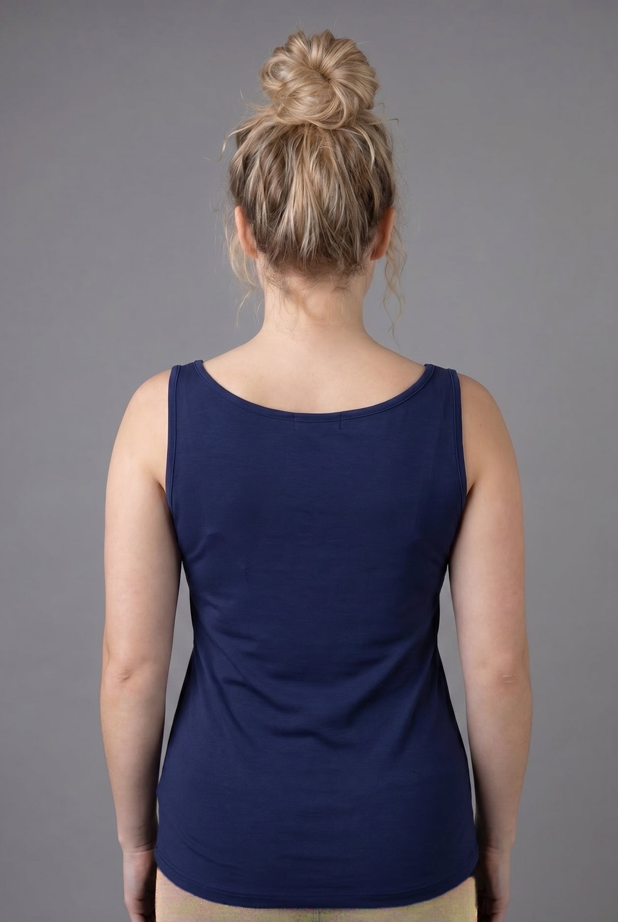 Model wearing Nuggles® Wide Neck Tank in Navy