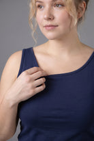Model wearing Nuggles® Wide Neck Tank in Navy