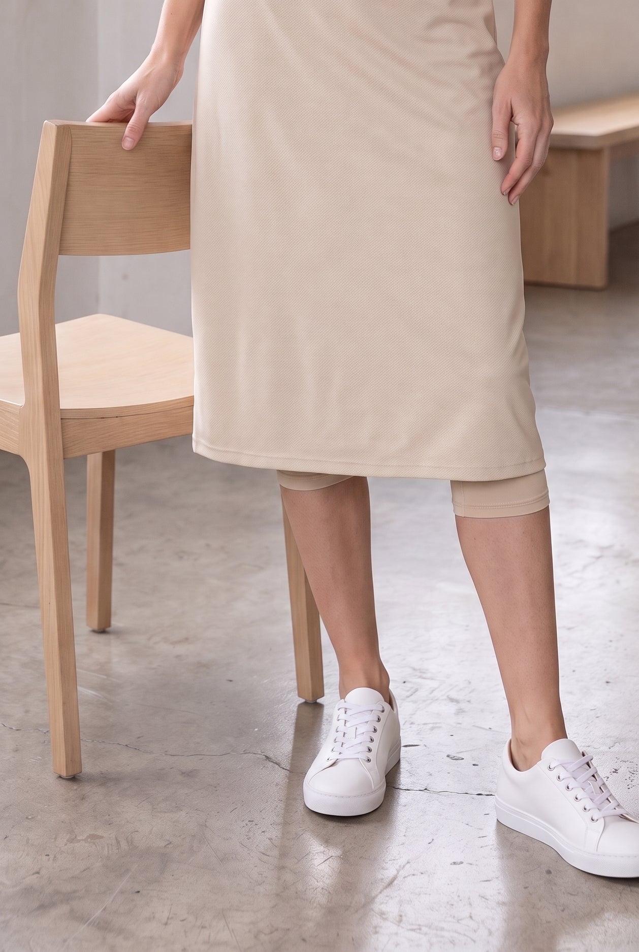 Model wearing Nuggles®  27" Sport Skirt in Nude