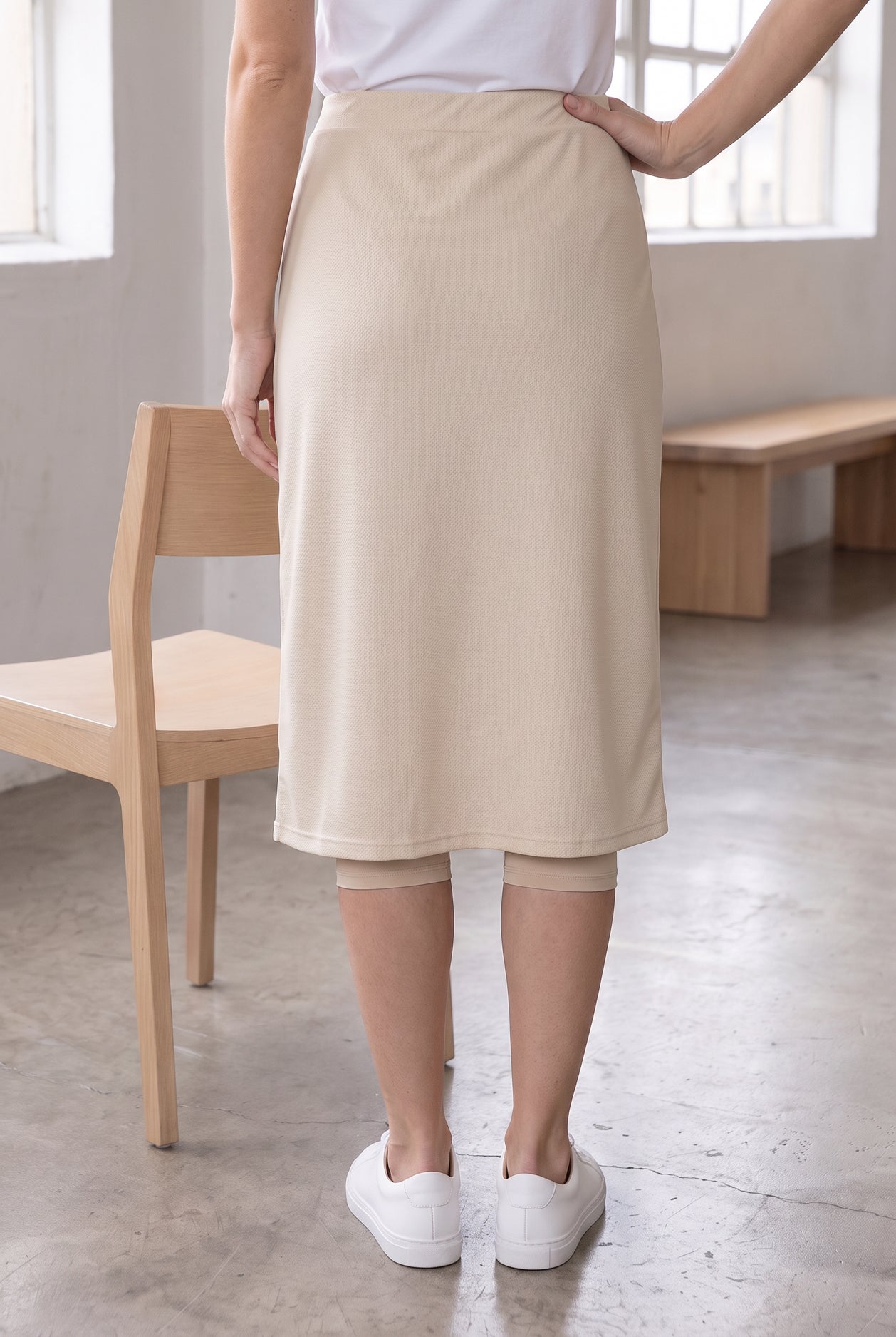 Model wearing Nuggles®  27" Sport Skirt in Nude