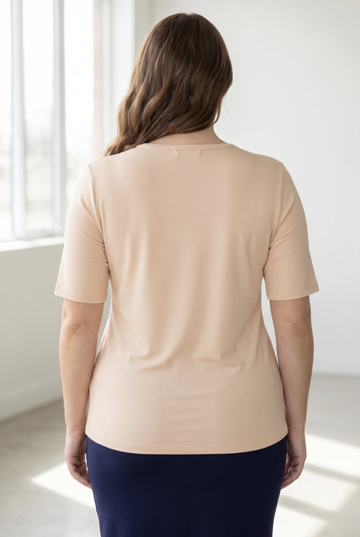 Model wearing the Nuggles® Essential Half Sleeve Tee in Nude