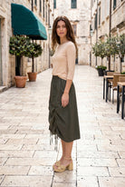 Model wearing Nuggles® Oriana Skirt in Olive Green