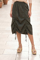 Model wearing Nuggles® Oriana Skirt in Olive Green