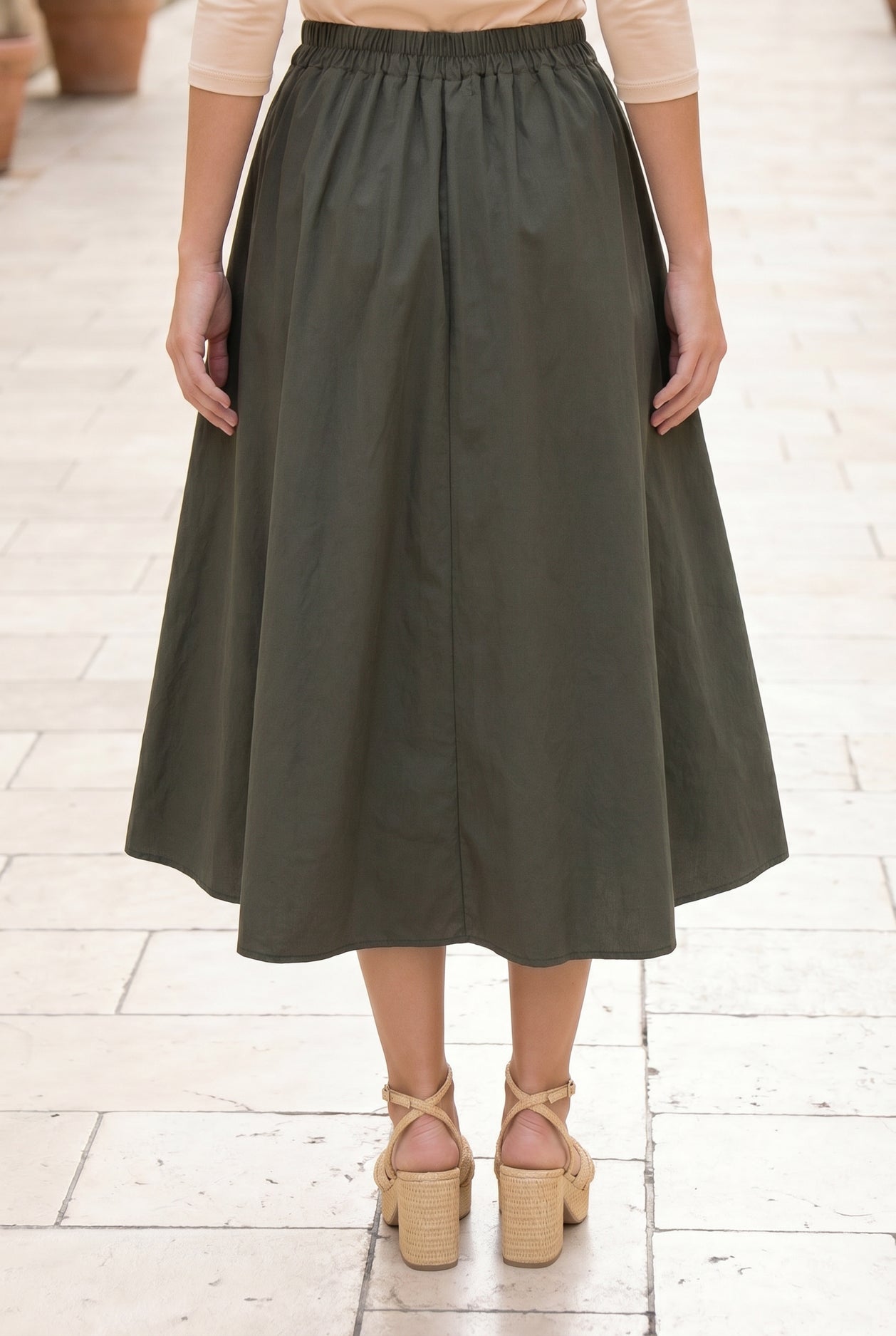Model wearing Nuggles® Oriana Skirt in Olive Green