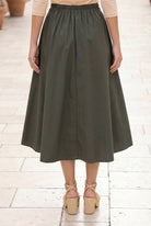 Model wearing Nuggles® Oriana Skirt in Olive Green