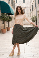 Model wearing Nuggles® Oriana Skirt in Olive Green