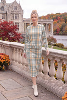 Model wearing Nuggles®  Iris Sweater Skirt in Olive Plaid
