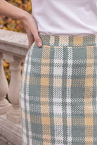 Model wearing Nuggles®  Iris Sweater Skirt in Olive Plaid
