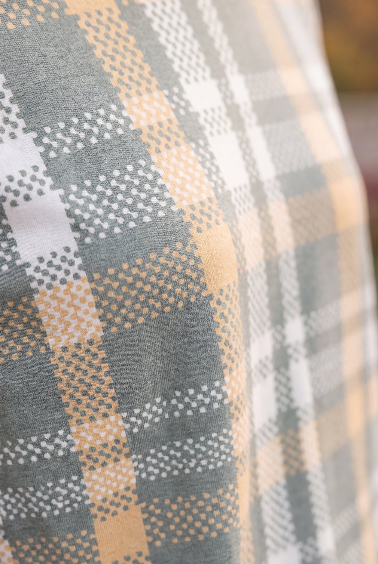 Model wearing Nuggles®  Iris Sweater Shirt in Olive Plaid