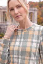 Model wearing Nuggles®  Iris Sweater Shirt in Olive Plaid