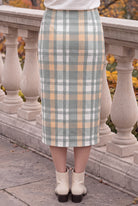 Model wearing Nuggles®  Iris Sweater Skirt in Olive Plaid
