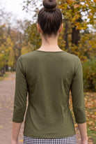 Model wearing Nuggles®  Essential 3/4 Sleeve Tee in Olive