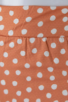 Model wearing Nuggles® 27" All-Sport Skirt in Orange Pop