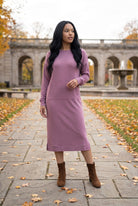 Nuggles® Oakley Hoodie Dress in Pale Purple, full-length front view on a leaf-covered park path with brown ankle boots