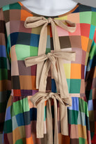 Model wearing Nuggles®  Addison Dress in Patch Pixels