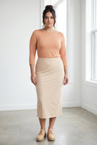 Model wearing Nuggles® 3/4 Essential Tee in Peach