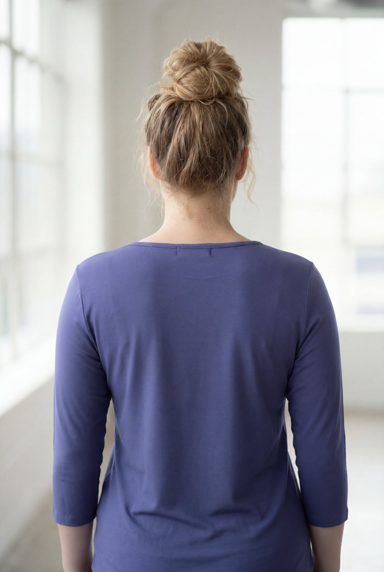 Model wearing Nuggles® 3/4 Essential Tee in Periwinkle Purple