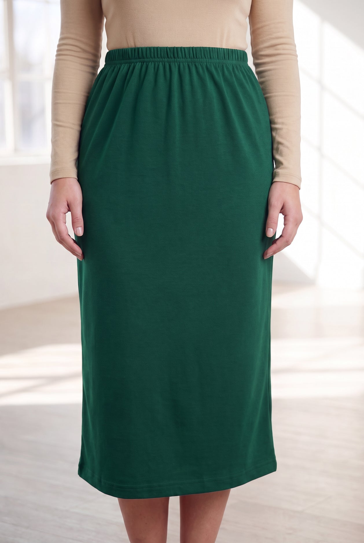 Nuggles® 31" Classic Skirt in Pine Green, waist-to-hem front view showing the straight knit drape