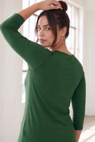 Model wearing Nuggles®  Essential  3/4 Tee in Pine Green