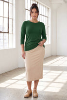 Model wearing Nuggles®  Essential  3/4 Tee in Pine Green