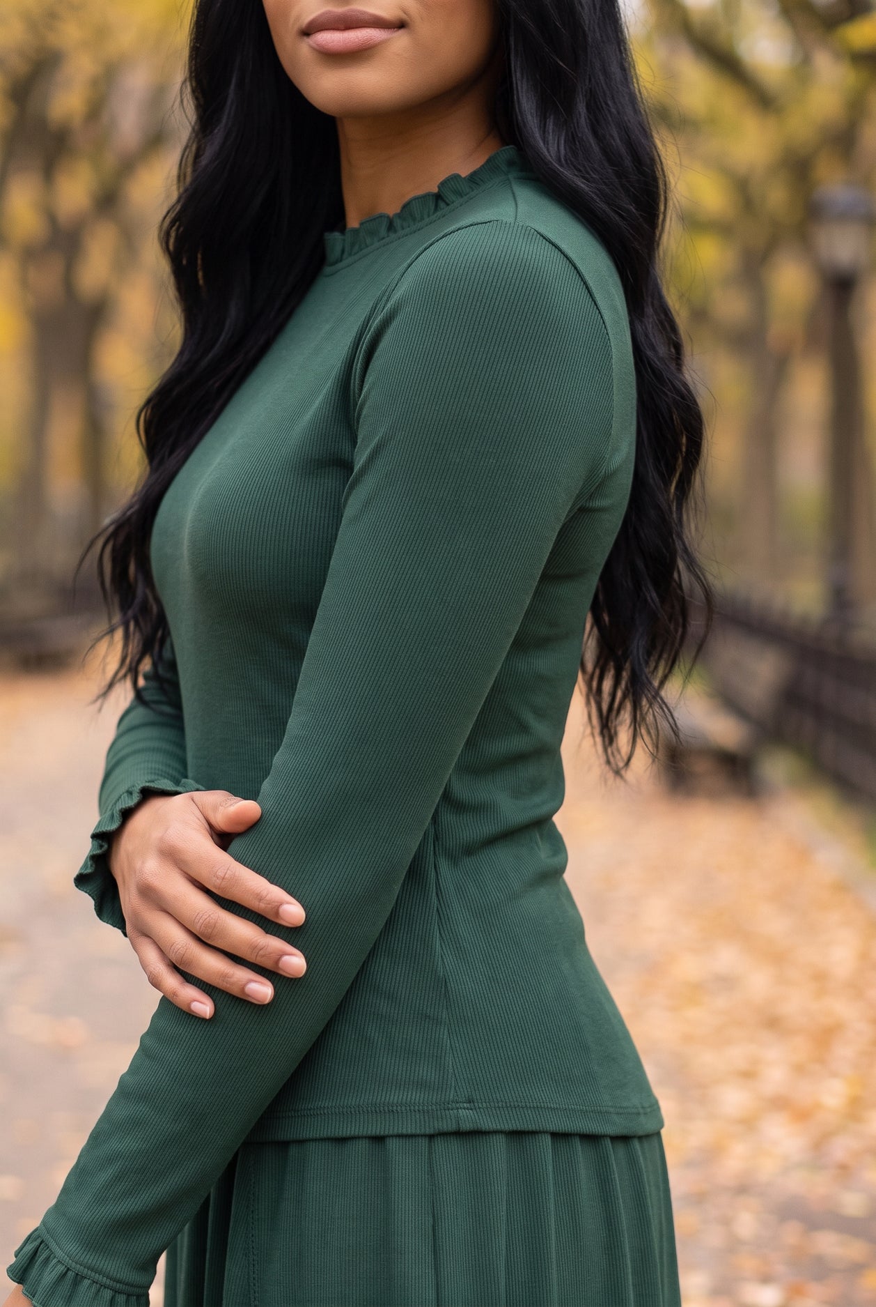 Model wearing Nuggles®  Bethany Shirt & Skirt in Pine Green