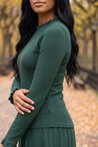 Model wearing Nuggles®  Bethany Shirt & Skirt in Pine Green