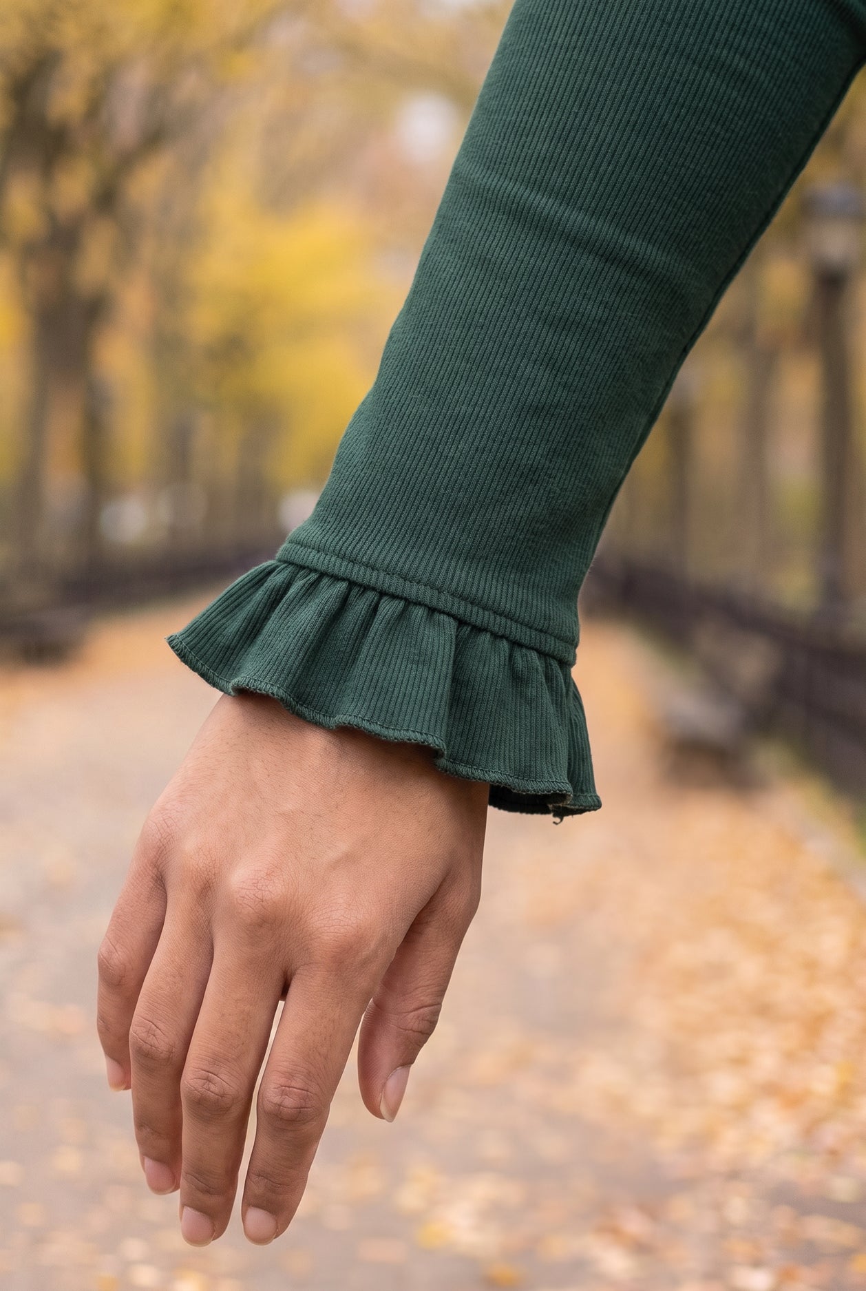Model wearing Nuggles®  Bethany Shirt & Skirt in Pine Green