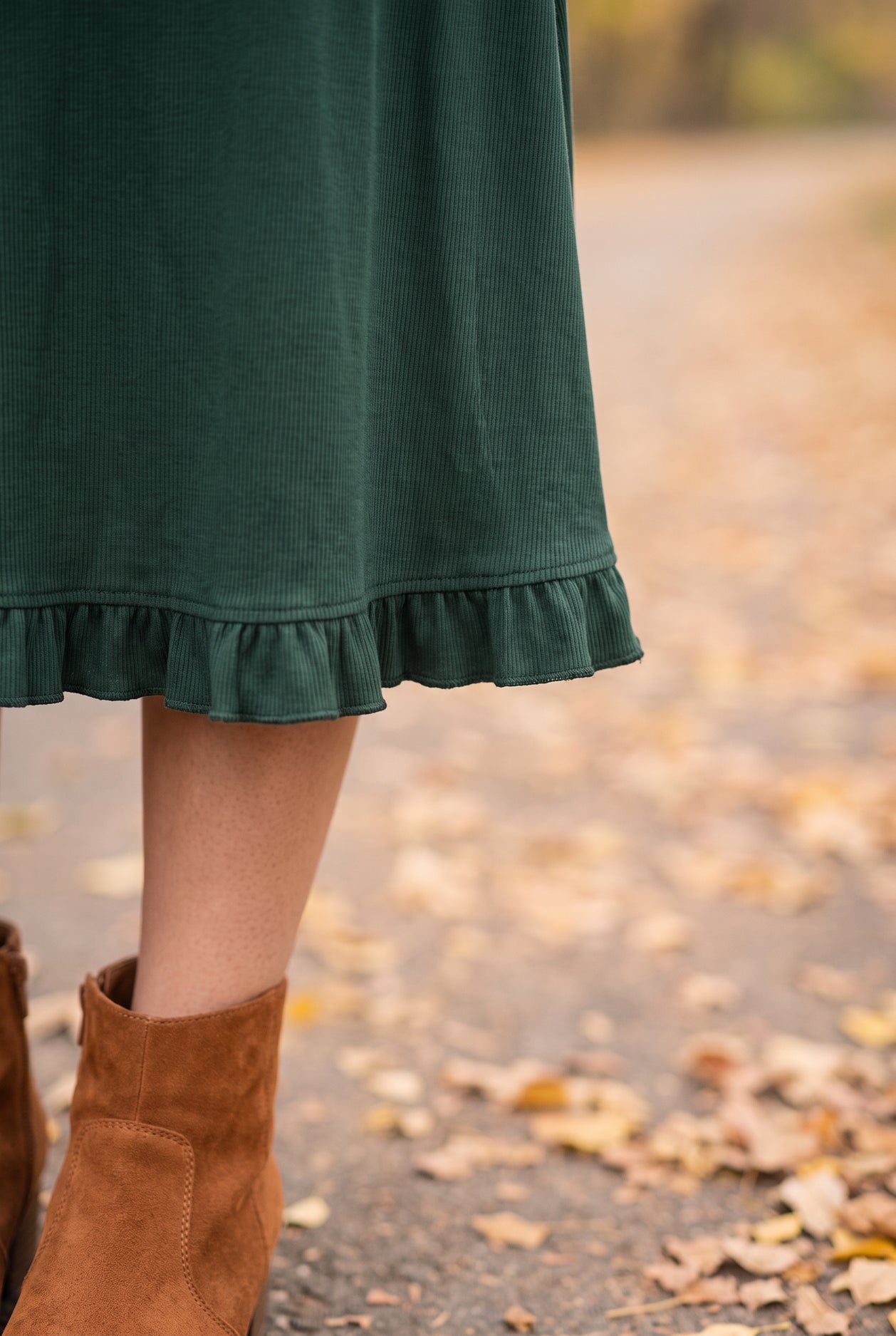 Model wearing Nuggles®  Bethany Shirt & Skirt in Pine Green