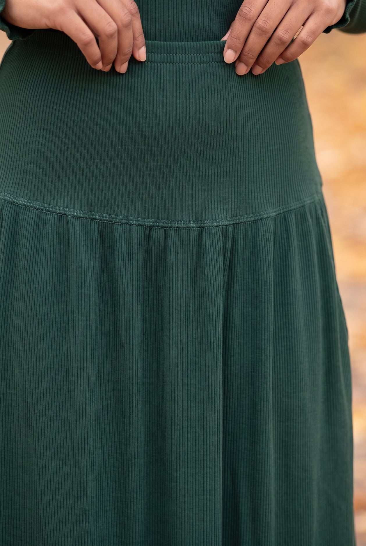 Model wearing Nuggles®  Bethany Shirt & Skirt in Pine Green