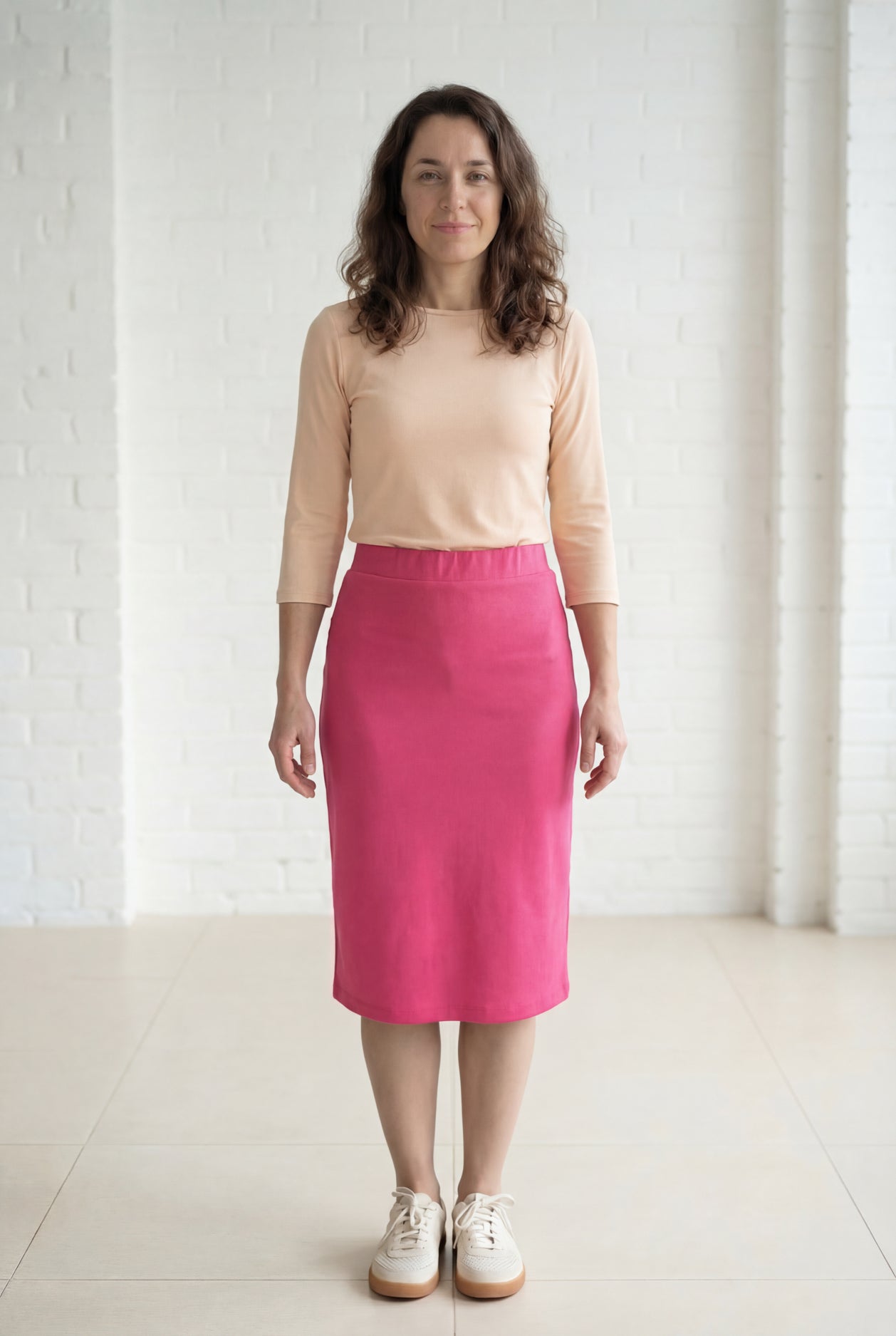 Model wearing Nuggles® 27" Relaxed Midi Skirt in Pink 