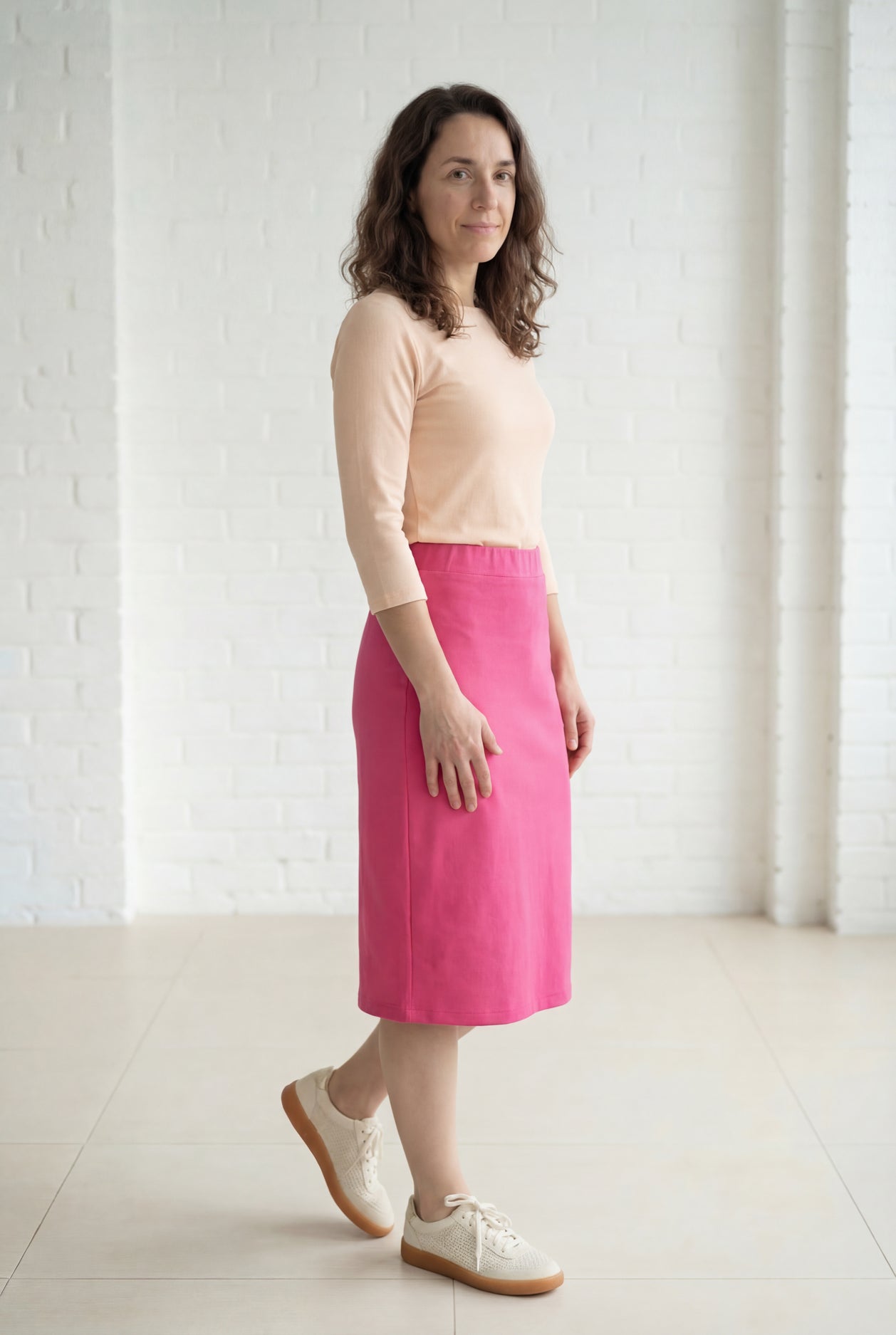 Model wearing Nuggles® 27" Relaxed Midi Skirt in Pink 