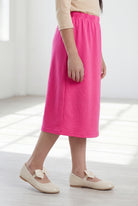 Model wearing Nuggles®  Girls Classic Skirt in Pink