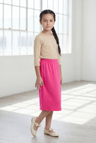 Model wearing Nuggles®  Girls Classic Skirt in Pink