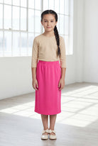 Model wearing Nuggles®  Girls Classic Skirt in Pink