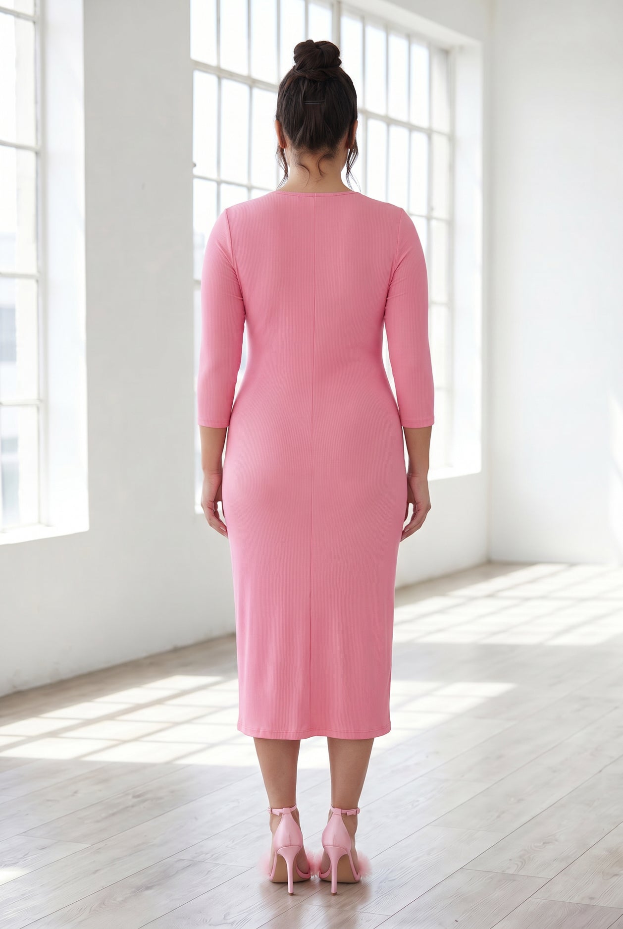 Model wearing Nuggles® Ribbed Midi Layering Dress in Pink