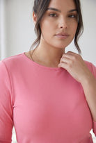 Model wearing Nuggles® 3/4 Essential Ribbed Tee in Pink