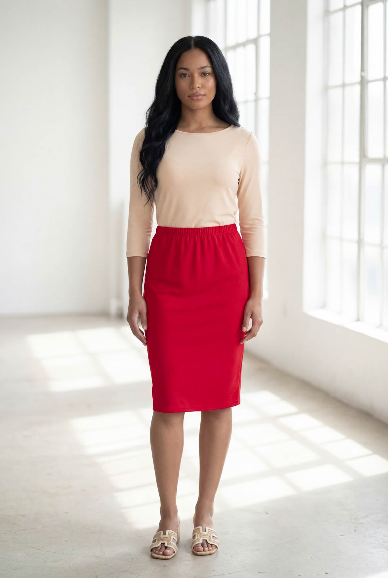Model wearing Nuggles® 25" Classic Skirt in Red