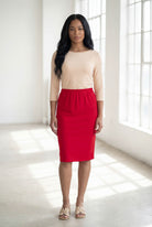 Model wearing Nuggles® 25" Classic Skirt in Red