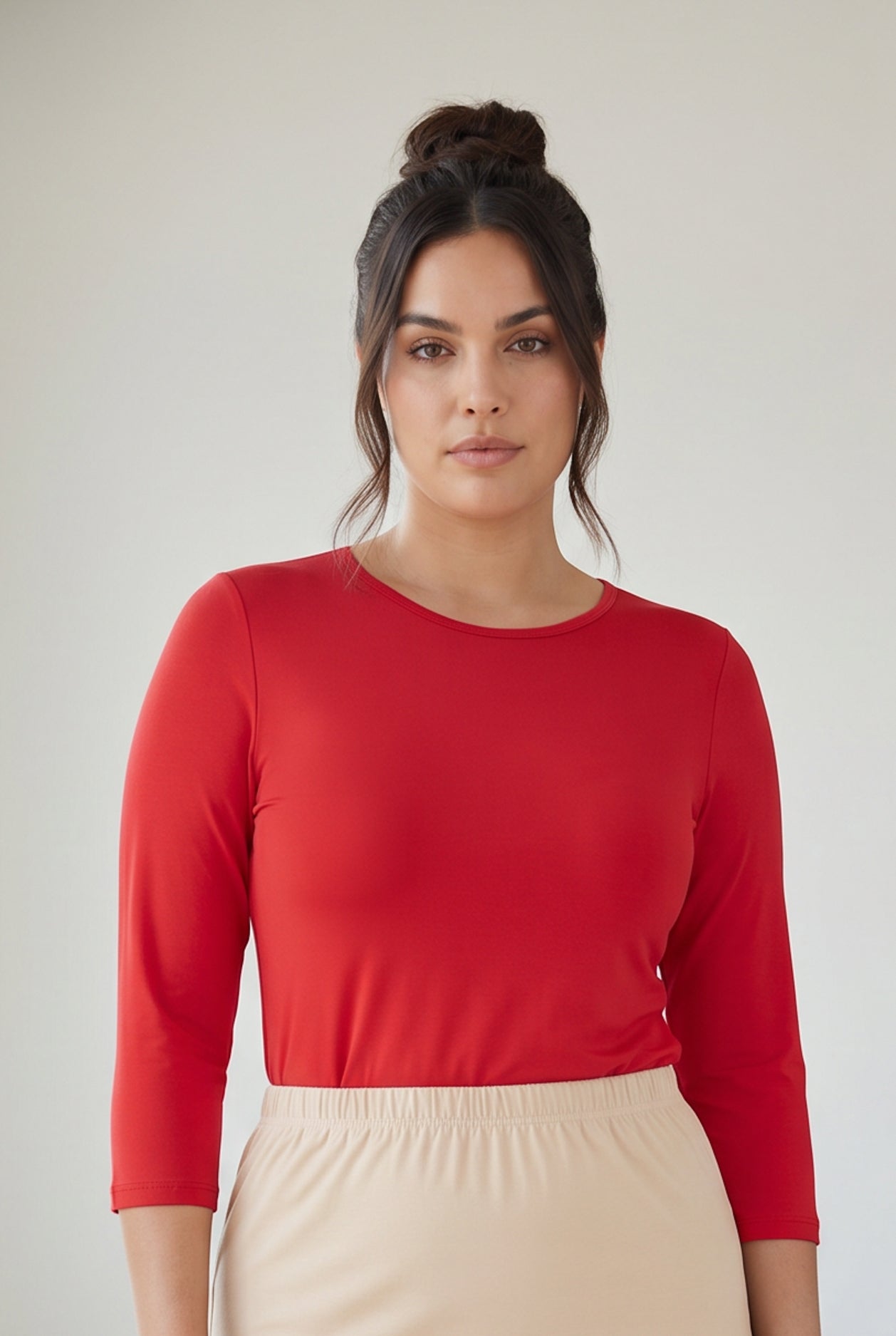Model wearing Nuggles® 3/4 Essential Tee in Red