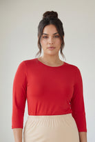 Model wearing Nuggles® 3/4 Essential Tee in Red
